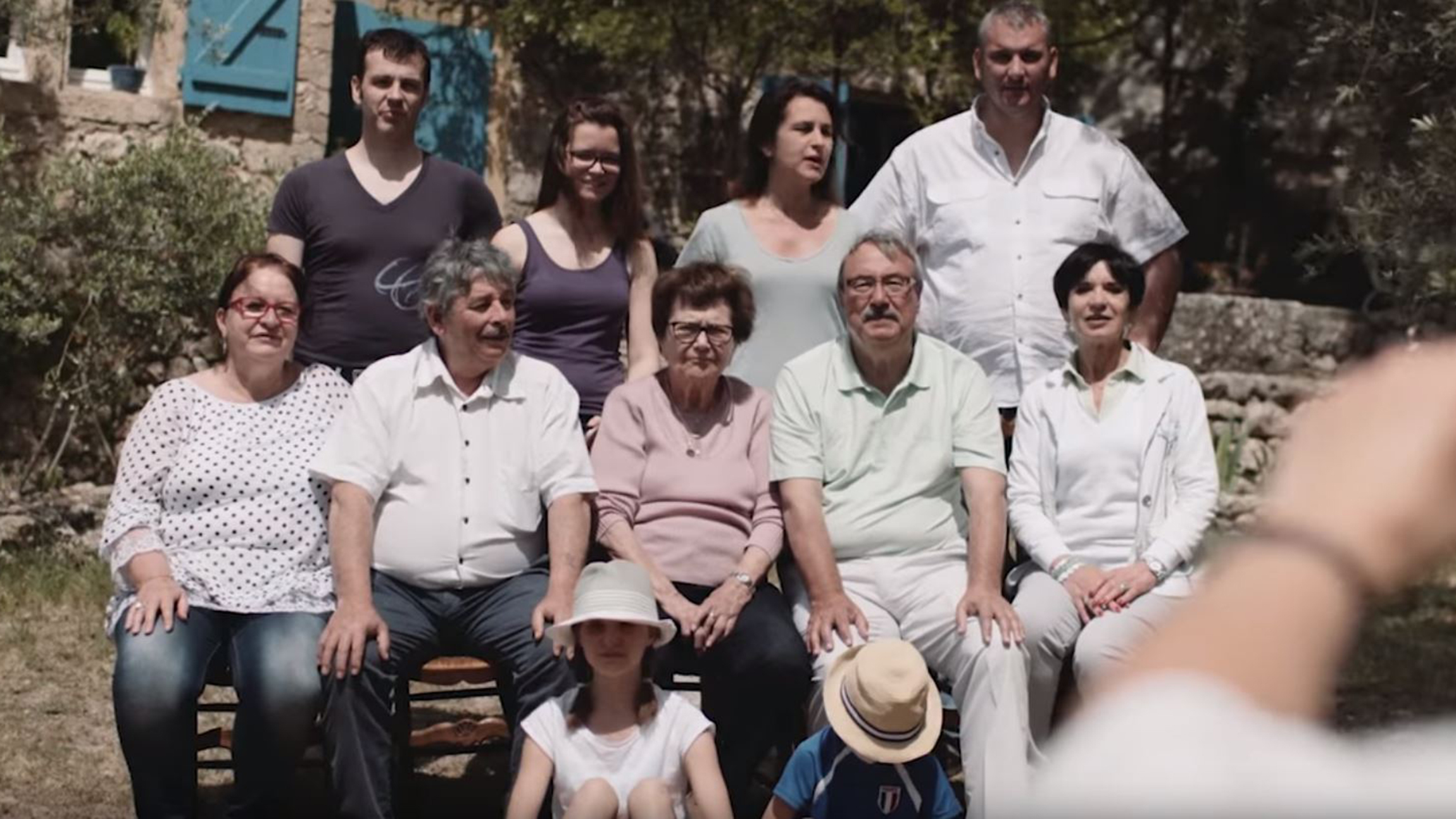 Jean-Luc and other people gathered for a group photo