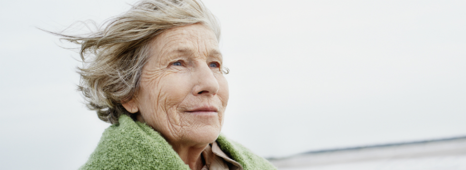 Woman wrapped up in blanket.